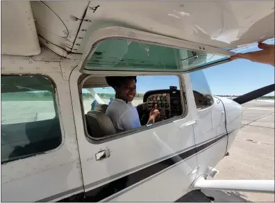  ?? PHOTOS BY SHEENA HOLLAND DOLAN — THE NEWS-HERALD ?? Diamond McClendon, a Richmond Heights high schooler in the aviation program, prepares for her first experience not only flying in a plane, but practicing piloting one.