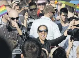  ?? Peter Kollanyi Associated Press ?? ELENI KOUNALAKIS, who served as U.S. ambassador to Hungary when Hillary Clinton was secretary of State, takes part in a pride parade in Budapest in 2012.