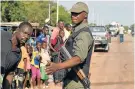  ?? Picture: AFP ?? ON GUARD: A policeman patrols in the centre of Ouahigouya, in northern Burkina Faso, which is particular­ly under threat from jihadists