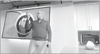  ?? AP/ELAINE THOMPSON ?? David Limp, senior vice president of devices and services at Amazon, uses an Amazon Echo Spot to chat with his wife on a monitor behind him during an event announcing several new Amazon products last week in Seattle.