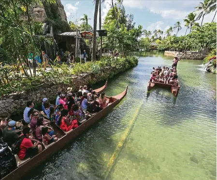  ??  ?? A tour by canoe is a relaxing way of seeing the Polynesian Cultural Center. — Photos: AirAsia