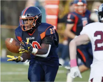  ?? PAUL CONNORS / BOSTON HERALD ?? FOR SIX: Milton Academy’s Kalel Mullings hauls in one of his three TD catches in the Mustangs 48-25 win over Belmont Hill on Saturday.