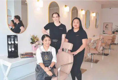  ??  ?? LEFT: Your Canvas owner Lan Cox (sitting) with staff members Stella Hering and Zoey Tran in the beauty salon's new premises at Rising Sun Plaza.
