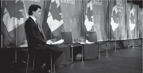  ?? RYAN REMIORZ / THE CANADIAN PRESS ?? Leadership candidate Justin Trudeau waits for his turn to speak at the Liberal party leadership debate in Montreal on Saturday.