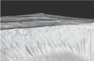  ?? AFP/NASA/JPL/UNIVERSITY OF ARIZONA ?? Dark streaks on Mars are formed by the flow of briny water.