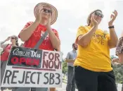  ?? Stephen Spillman / San Antonio Express-News ?? Mercy Lawler and Kristina Borden join in a “Keep Texas Open for Business” rally, urging legislator­s to reject the bathroom bill. Story on page B1.