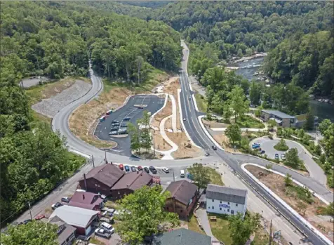  ?? Andrew Rush/Post-Gazette photos ?? Constructi­on continues Thursday on the Ohiopyle Multimodal Gateway Project on Route 381 in Ohiopyle.