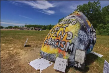  ?? PHOTOS BY GEORGE NORKUS — FOR THE MACOMB DAILY ?? Pictured is the Romeo Rock along Van Dyke north of 30Mile Road in Washington Township on Tuesday. The owners of the vacant property where the boulder sits is likely to be moved to a different location following a racist message that had been painted on the rock in response to a previous message supporting the Black Lives Matter movement.