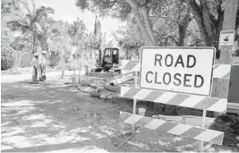  ?? CARLINE JEAN/STAFF FILE PHOTO ?? Crews work on sewage pipes in the neighborho­od of Southwest Sixth Avenue in Fort Lauderdale after Hurricane Irma in September.