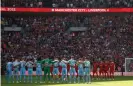  ?? Tom Jenkins/The Guardian ?? The two teams line up for a minute’s silence to remember the Hillsborou­gh victims before the FA Cup semi-final match between Manchester City and Liverpool. Photograph: