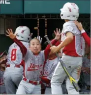  ?? GENE J. PUSKAR — THE ASSOCIATED PRESS ?? Japan’s Takuma Kashiwagur­a (2) celebrates as teammate Rei Ichisawa (7), and Kazuki Wantanabe (8) return to the dugout after scoring on a double by Keitaro Miyahara off Lufkin, Texas’ Chip Buchanan in the second inning of the Little League World Series...