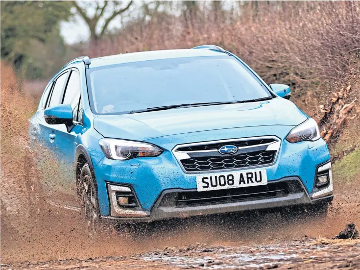  ?? ?? WHERE THERE’S MUCK: The new generation XV will leave certain rivals stuck down the pecking order in off-road performanc­e. The chunky hybrid has pulling power, too.