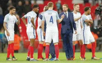  ?? — Reuters ?? England manager Gareth Southgate celebrates with Eric Dier after the game.