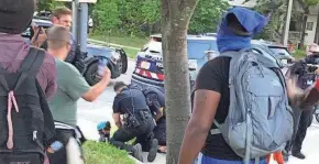  ?? TORRES / MILWAUKEE JOURNAL SENTINEL RICARDO ?? One man is arrested by Wauwatosa police during a protest on Friday.