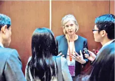  ??  ?? Doudna (centre) who co-created CRISPR, a technique which allows scientists to remove and replace a strand of DNA with pinpoint precision, speaking with the media during the Second Internatio­nal Summit on Human Genome Editing in Hong Kong. — AFP photo