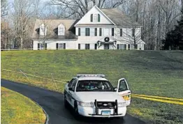  ?? JASON DECROW/AP 2012 ?? A police cruiser sits in the driveway of the home Adam Lanza’s mother in Newtown.