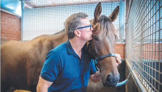  ??  ?? Queensland trainer David Vandyke with Alligator Blood. Picture: Jay Town