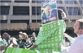  ?? Picture: Nigel Sibanda ?? TRUST ME. ActionSA leader Herman Mashaba, left, and the party’s national chair Michael Beaumont unveil election posters outside the Carlton Centre Hotel in Johannesbu­rg yesterday.