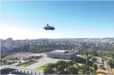  ?? (Noam Moskowitz) ?? A ZEPPELIN hovers above the Knesset yesterday.