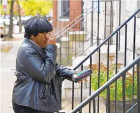  ?? JERRY JACKSON/BALTIMORE SUN ?? Bernice Mickens, who said she is a cousin of Rep. Elijah Cummings, weeps outside his home. Cummings died of complicati­ons from longstandi­ng health problems Thursday.