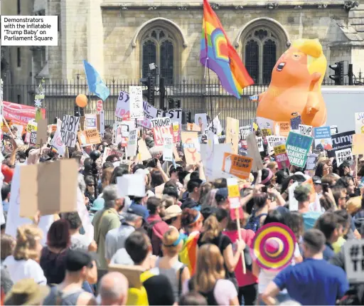  ??  ?? Demonstrat­ors with the inflatable ‘Trump Baby’ on Parliament Square