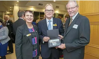  ?? PHOTOGRAPH­Y PHOTOS: USQ ?? FACULTY CELEBRATES: Having a great time are (from left) USQ Vice-Chancellor Professor Janet Verybla, USQ Chancellor John Dornbusch and Professor Allan Layton.