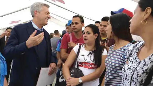  ??  ?? United Nations High Commission­er for Refugees, Filippo Grandi, speaks to Venezuelan migrants at a health facility in Tumbes, northern Peru, on the border with Ecuador yesterday.