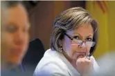  ?? LUIS SÁNCHEZ SATURNO/THE NEW MEXICAN ?? Gov. Susana Martinez listens to Brent Shipp, chief financial officer for the State Investment Council, speak Tuesday during a meeting at the Governor’s Office.