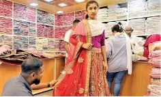  ?? ?? With Deepavali falling today some shoppers were seen buying clothes in Pettah. Pix by Nilan Maligaspe