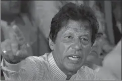  ?? The Associated Press ?? ‘BITTER PILL’: In this July 28, 2017, photo, Pakistani opposition leader Imran Khan gestures during a news conference in Islamabad, Pakistan. Khan said Saturday that meeting U.S. President Donald Trump would be a “bitter pill” to swallow should he...