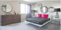  ?? CAMPANALE HOMES ?? Contempora­ry comfort: In the master bedroom in the Commuter 2 home in Longfields a seemingly floating bed is paired with a simple colour palette, a mixture of curves and straight lines, and plenty of mirrors to help light up the space.