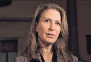  ?? CP PHOTO ?? Ontario Francophon­e Affairs Minister Caroline Mulroney speaks to reporters following an early morning PC Caucus meeting at the Ontario Legislatur­e in Toronto on Thursday. Mulroney’s Parliament­ary Assistant, PC MPP Amanda Simard, has resigned from the party.