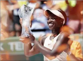  ?? ASSOCIATED PRESS ?? Sloane Stephens holds her trophy after defeating Jelena Ostapenko, of Latvia, in the final at the Miami Open tennis tournament, Saturday in Key Biscayne, Fla. Stephens won 7-6 (5), 6-1.