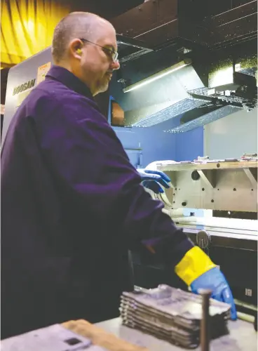  ?? Adrian Brown / Sipa
Press ?? Damon Gaucher produces ventilator parts at Simalex in Langley, B.C., on April 2. The ramping up of medical capacity may be a road map, Kevin Carmichael writes.