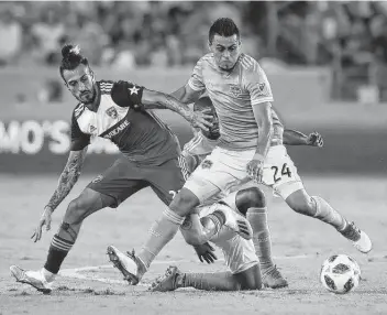  ?? Steve Gonzales / Staff photograph­er ?? In his first eight Major League Soccer seasons — spent with Toronto, Portland, Dallas and Montreal — new Dynamo forward Maxi Urruti, left, totaled 53 goals in 208 games.