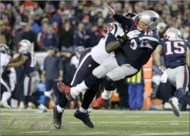  ?? ELISE AMENDOLA - THE ASSOCIATED PRESS ?? In this Jan. 14, 2017, file photo, Houston Texans defensive end Jadeveon Clowney (90) levels New England Patriots quarterbac­k Tom Brady (12) after Brady released a pass during the first half of an NFL divisional playoff football game, in Foxborough,...
