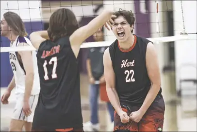  ?? Chris Torres/ The Signal ?? (Above) Hart senior Brandon Derham (22) and junior Tanner Andrew (17) celebrate Derham winning a piont during the fifth set of Thursday’s Foothill League matchup against Valencia at Valencia High School. (Below) Valencia outside hitter Jarek Pascua (6) tries to get a hit past Andrew during the fourth set of Thursday’s matchup.