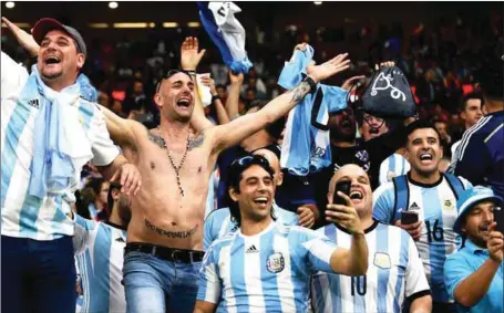  ??  ?? Argentine fans rooting for their team but many of them will miss the finals next month in Russia