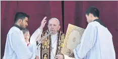  ?? AFP ?? Pope Francis blesses the faithful from the balcony of St Peter’s Basilica at the end of the traditiona­l ‘Urbi et Orbi’ Christmas message yesterday.