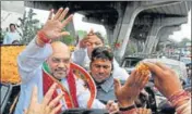  ??  ?? BJP national president Amit Shah greets supporters in Jammu on Saturday. NITIN KANOTRA/HT