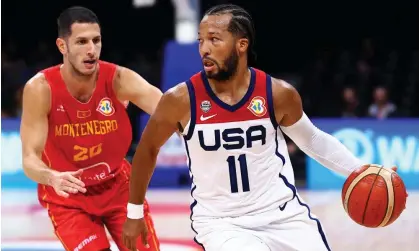  ?? ?? ▲ Jalen Brunson of the United States controls the ball against Nikola Ivanovic of Montenegro in the third quarter of Friday’s game at Mall of Asia Arena in Manila. Photograph: Yong Teck Lim/Getty Images