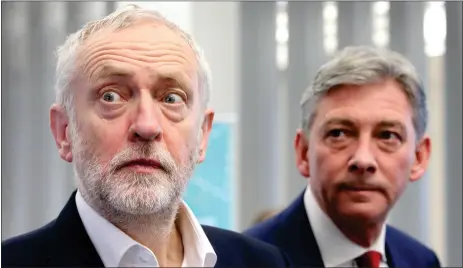  ??  ?? „ Labour leader Jeremy Corbyn, with Scottish leader Richard Leonard, at Abertay University yesterday – perhaps they had a premonitio­n of the gaffe.