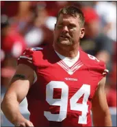  ?? NHAT V. MEYER — BAY AREA NEWS GROUP FILE ?? The 49ers’ Justin Smith walks on the sidelines during their game against the Chargers in the third quarter of their preseason game in Santa Clara in August of 2014.