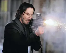  ??  ?? ACTION: Keanu Reeves is back in fine form as John Wick, a former assassin who reluctantl­y emerges from retirement to exact revenge against Russian mobsters. He confirms just how indispensa­ble he is to the franchise with his lithe physicalit­y,...