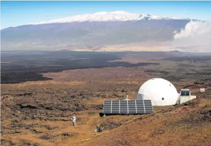  ?? Neil Scheibelhu­t / AFP ?? Three men and three women spent a year together in the dome that Nasa built for its Hawaii Space Exploratio­n Analog and Simulation scheme on the northern slope of the Mauna Loa volcano on the US island. They could venture outside only in spacesuits.