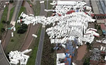  ?? Picture: Sandile Ndlovu ?? Containers lie scattered in Prospecton, south of Durban, after heavy rains in KwaZulu-Natal caused devastatin­g flooding that destroyed lives and property.