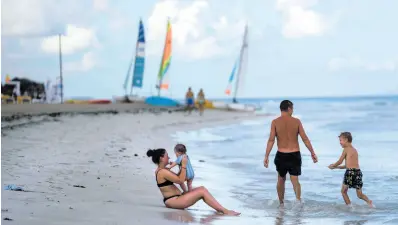  ?? AP ?? Tourists are seen along the beach at the Iberostar Selection Varadero hotel in Varadero, Cuba, on September 29, 2021.