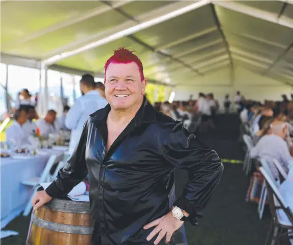  ?? ?? Port Douglas resident and celebrity businessma­n Darryn Lyons enjoys the Longest Lunch at Friday's launch of Carnivale. Picture: Tanya Snelling