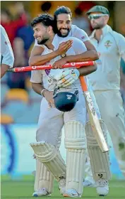  ?? PTI ?? Mohammed Siraj (centre) celebrates India’s win with Rishabh Pant at the Gabba in Brisbane on Tuesday. —