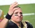  ?? AP ?? Saints quarterbac­k Drew Brees waves to his family and fans after the game.